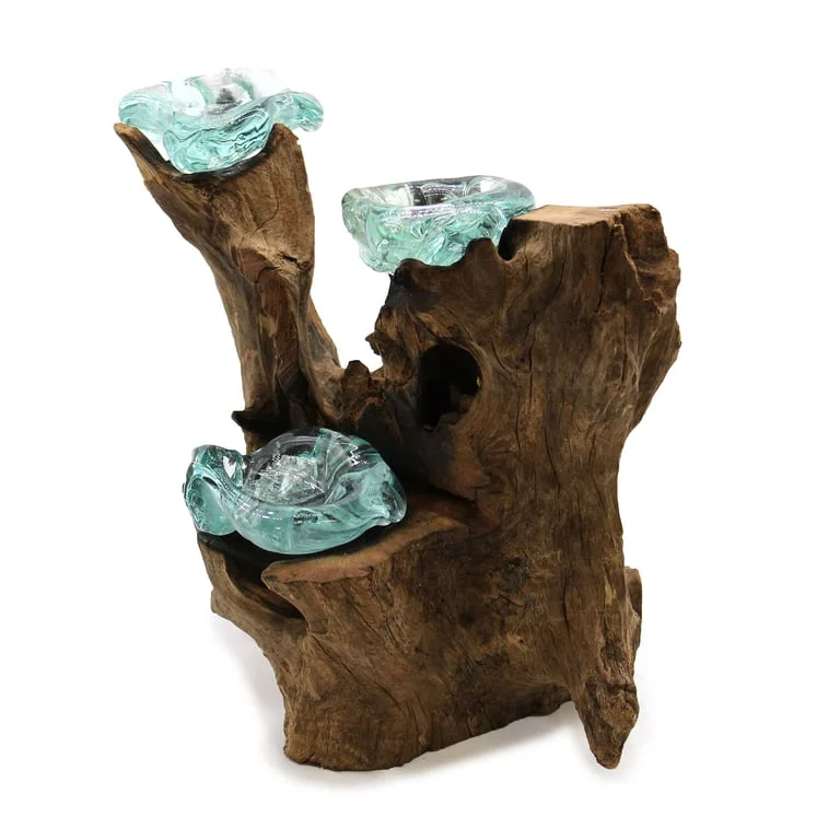 Decorative candle holder with three glass globes on a wooden stand.