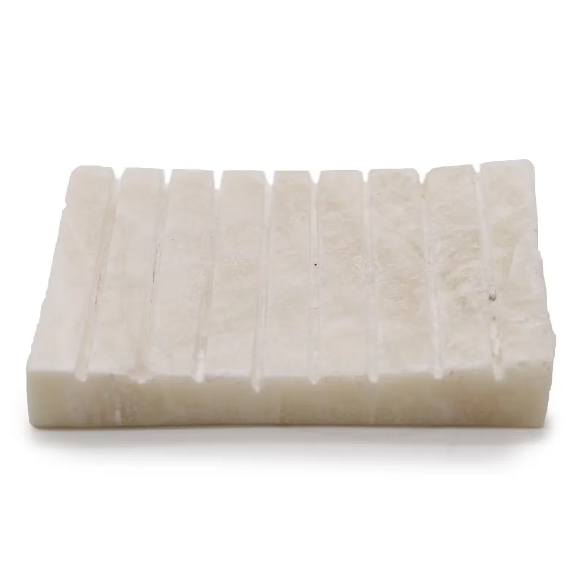 White onyx soap tray with ridged design.