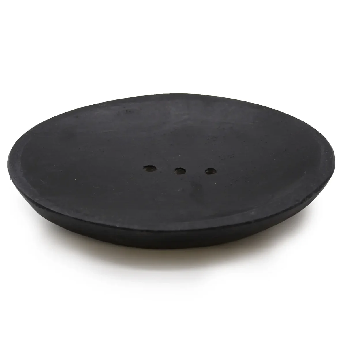 Oval black marble soap dish on a table surface