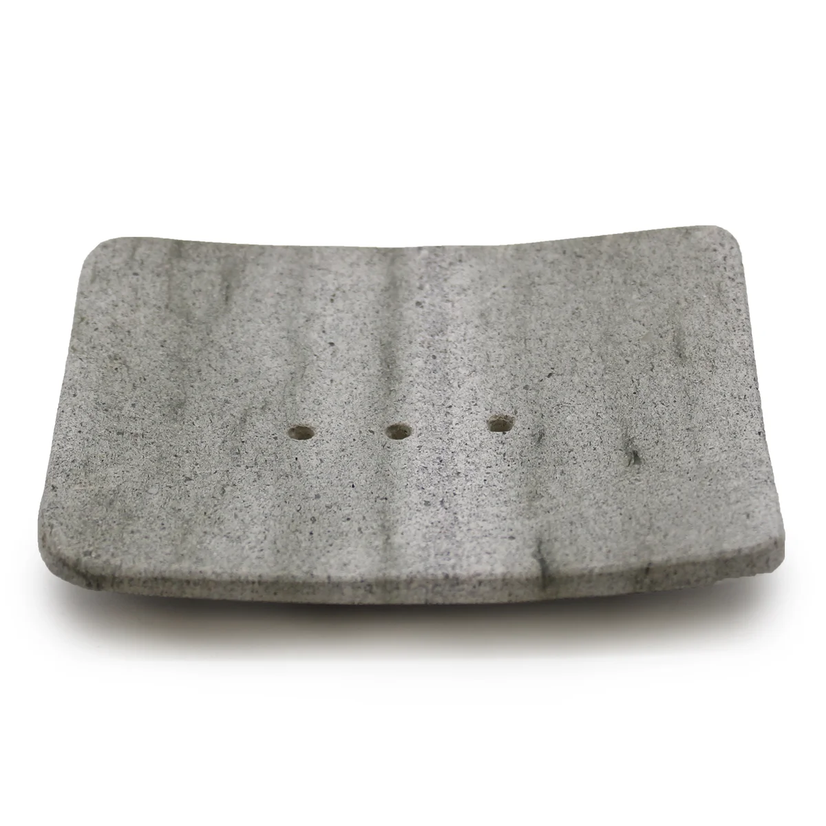 Square ziolit soap dish with smooth stone surface.
