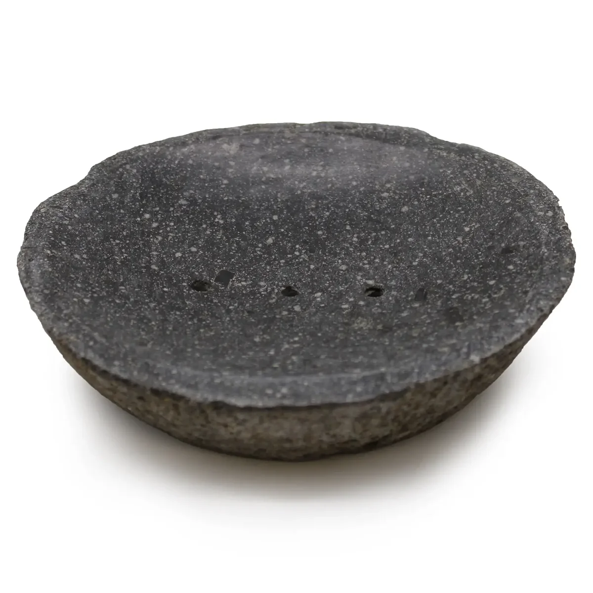 riverstone soap dish displayed on a plain surface.