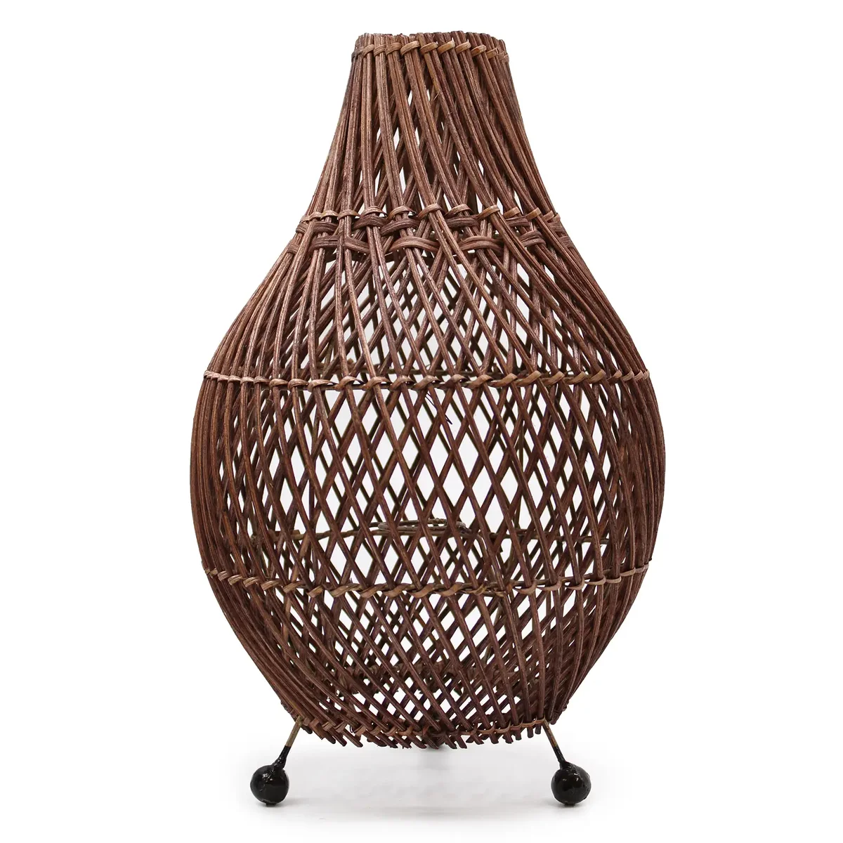Dark brown lamp with rattan shade rests on a tabletop.