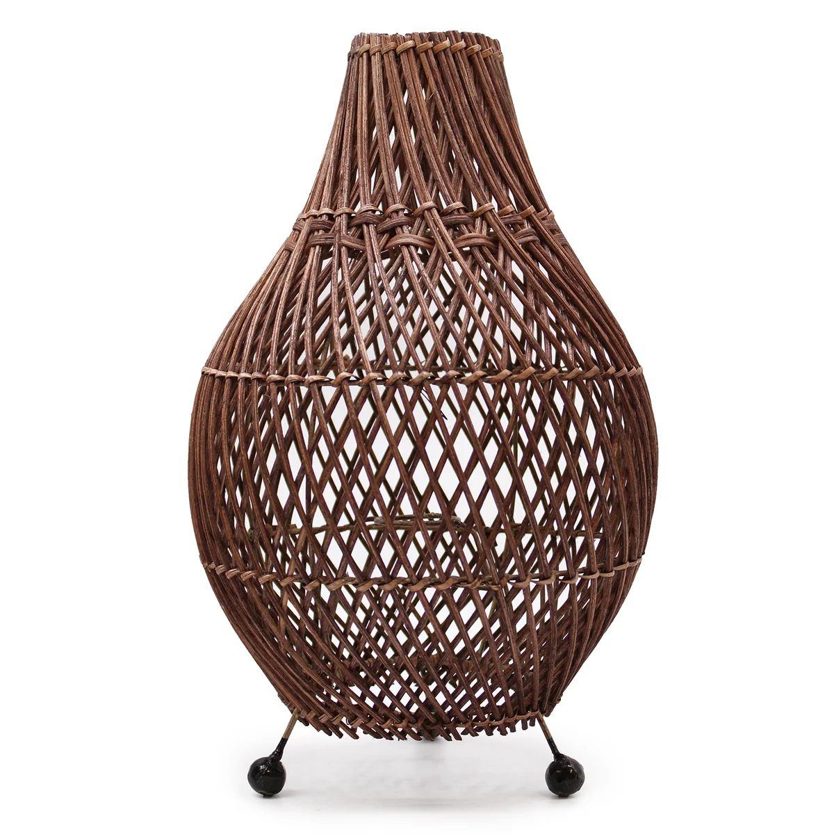 Dark brown rattan table lamp on a table.