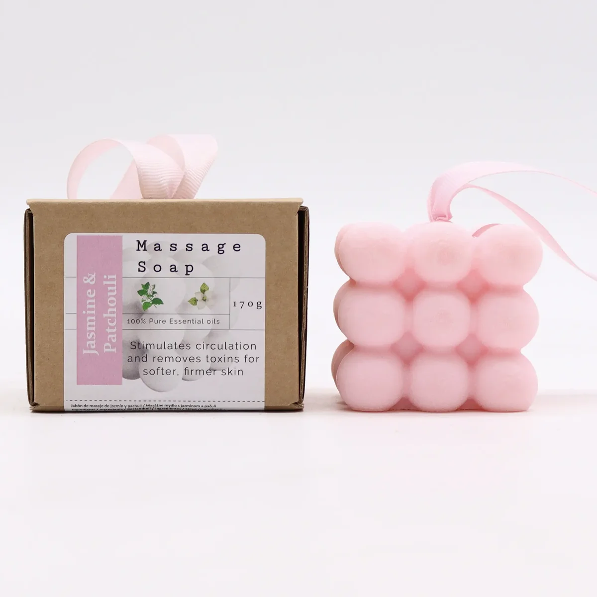 Boxed single massage soaps with jasmine and patchouli soap, soap bars neatly stacked inside a decorative cardboard box.