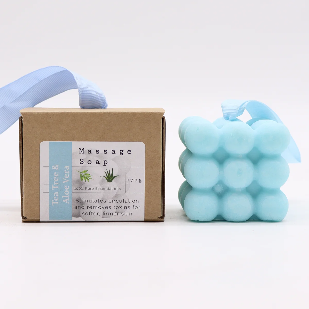 Boxed single massage soap with tea tree and aloe vera scents, wrapped in green packaging.