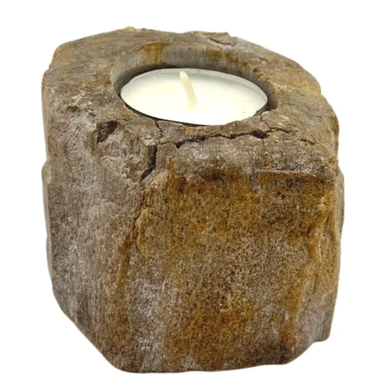 Petrified wood candle holder with a single low candle positioned centrally.