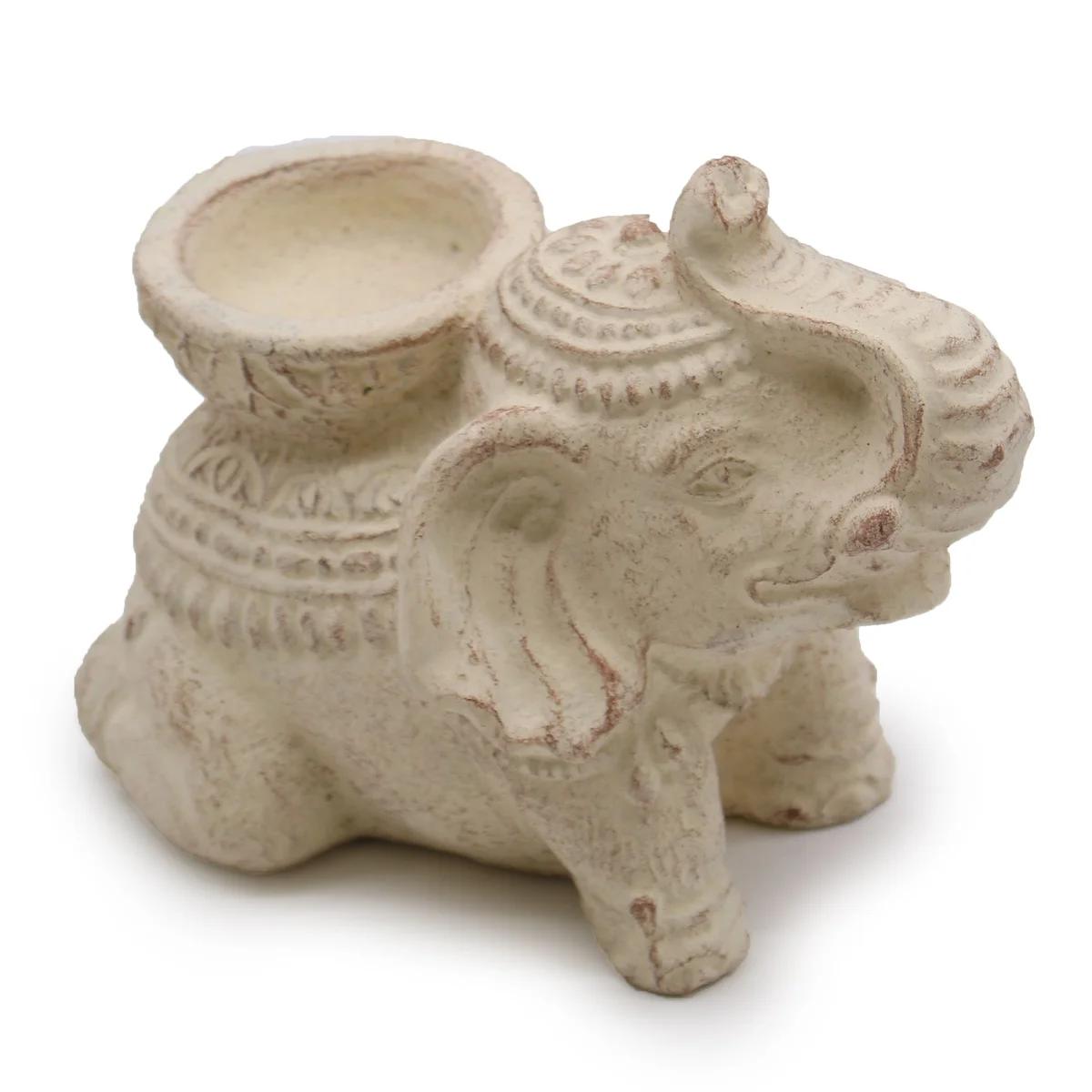 Cream elephant incense holder and candle holder with carved details on a white background