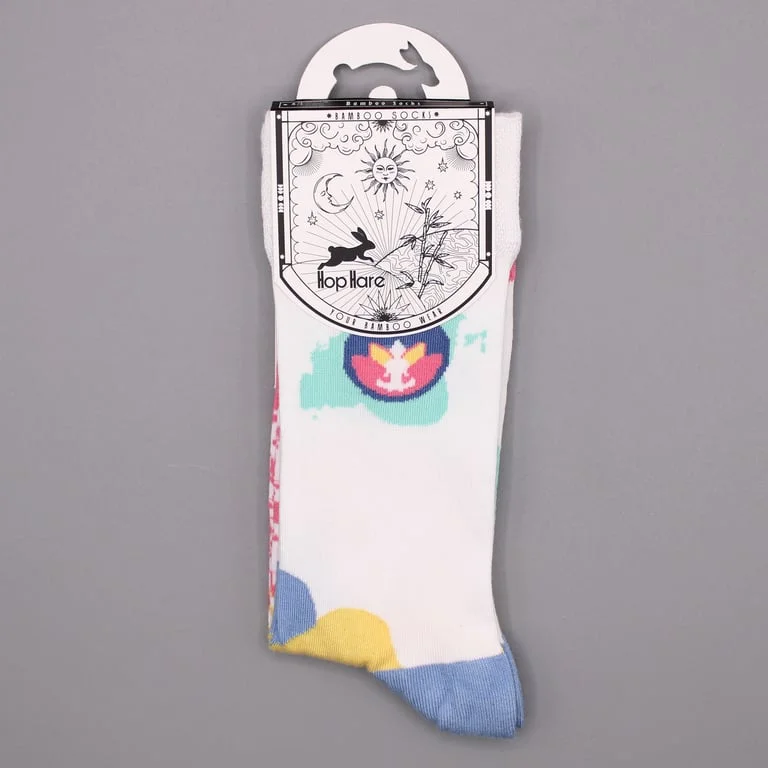 Comfortable bamboo socks in neutral tones displayed on a wooden surface.