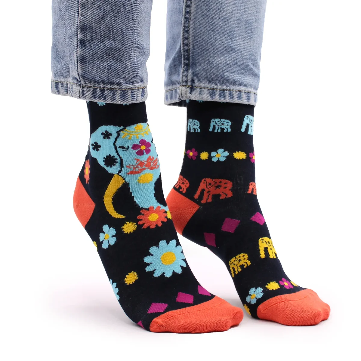 Pair of Hop Hare S/M bamboo socks featuring a colorful cosmic elephant design on a white background