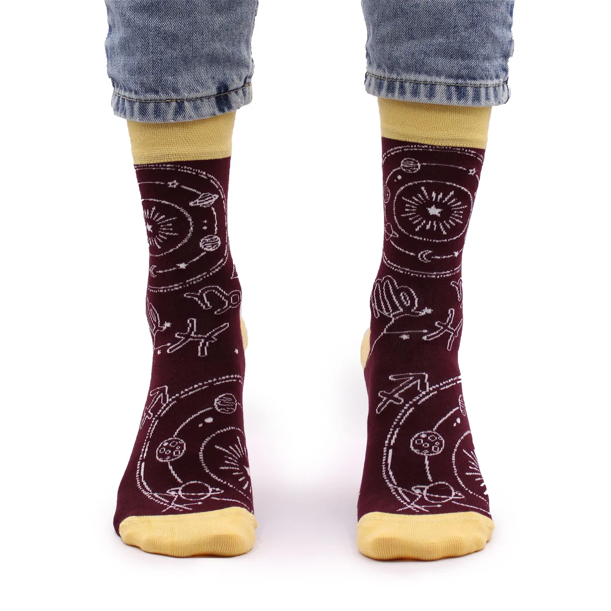 Pair of Hop Hare Zodiac bamboo socks in size S/M with colorful zodiac-themed designs on a white background