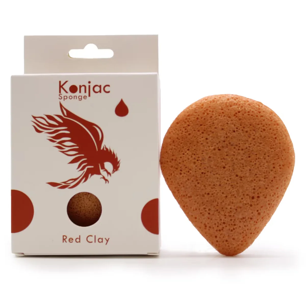 Teardrop-shaped red clay facial sponge with textured surface for rejuvenating skincare routine on white background