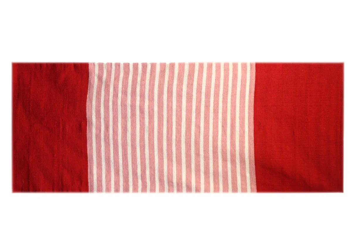 Red and pink Indian cotton rug measuring 70x170cm.