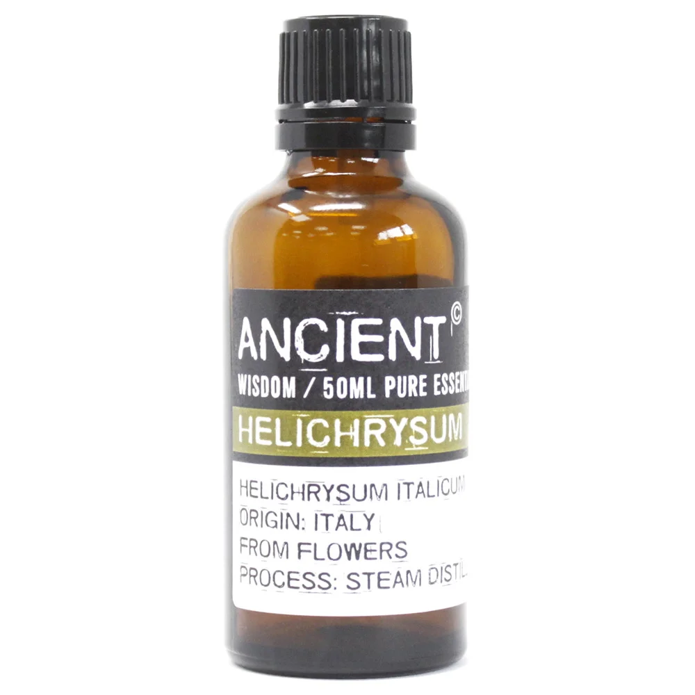 Clear glass bottle of Helichrysum aromatherapy oil 50ml with white label and silver cap on a white background