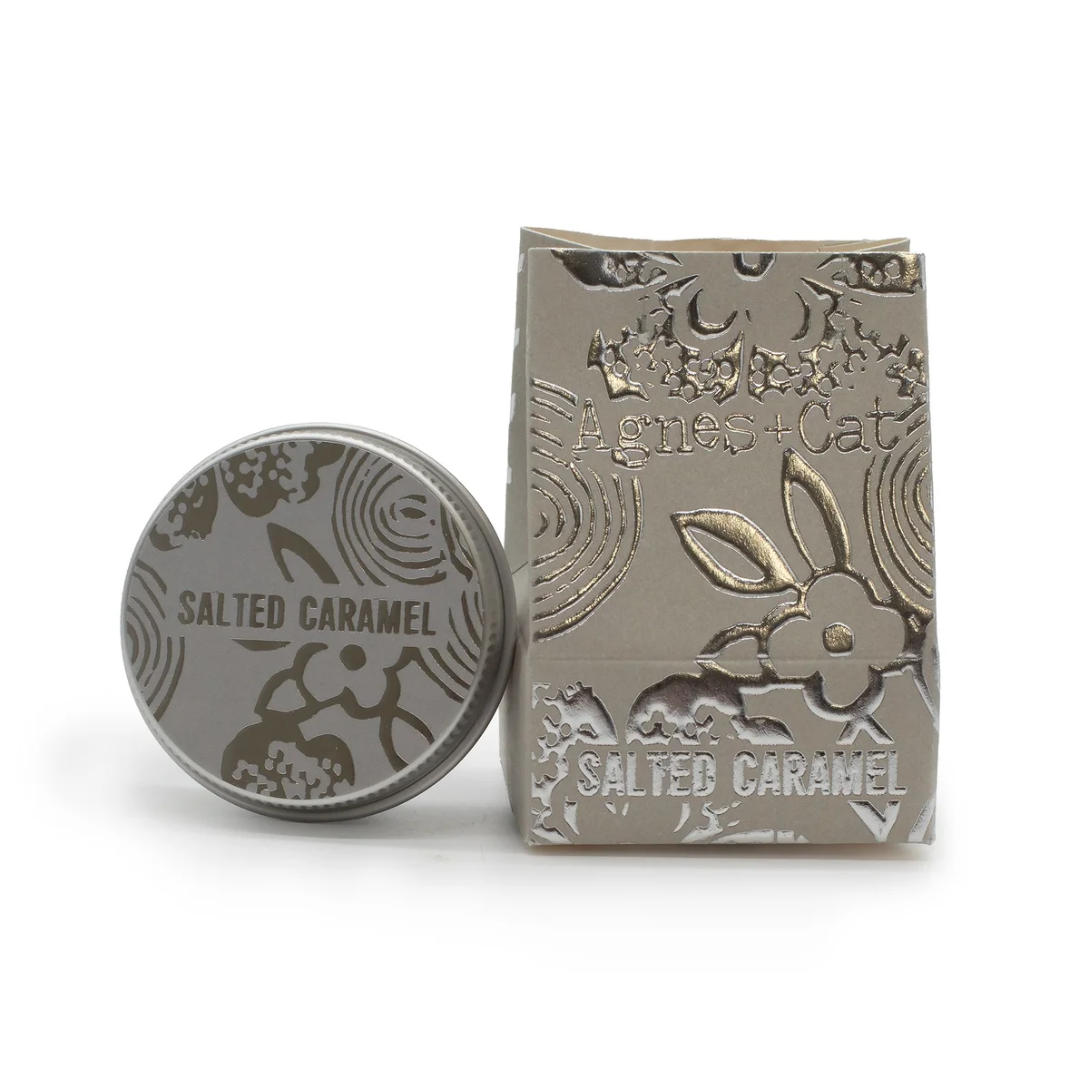 Agnes + Cat Salted caramel lip balm tube with caramel-colored cap on white background