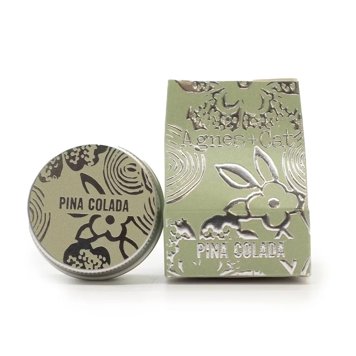 Agnes + Cat Pinacolada fruit scented lip balm tube with tropical fruit design on white background