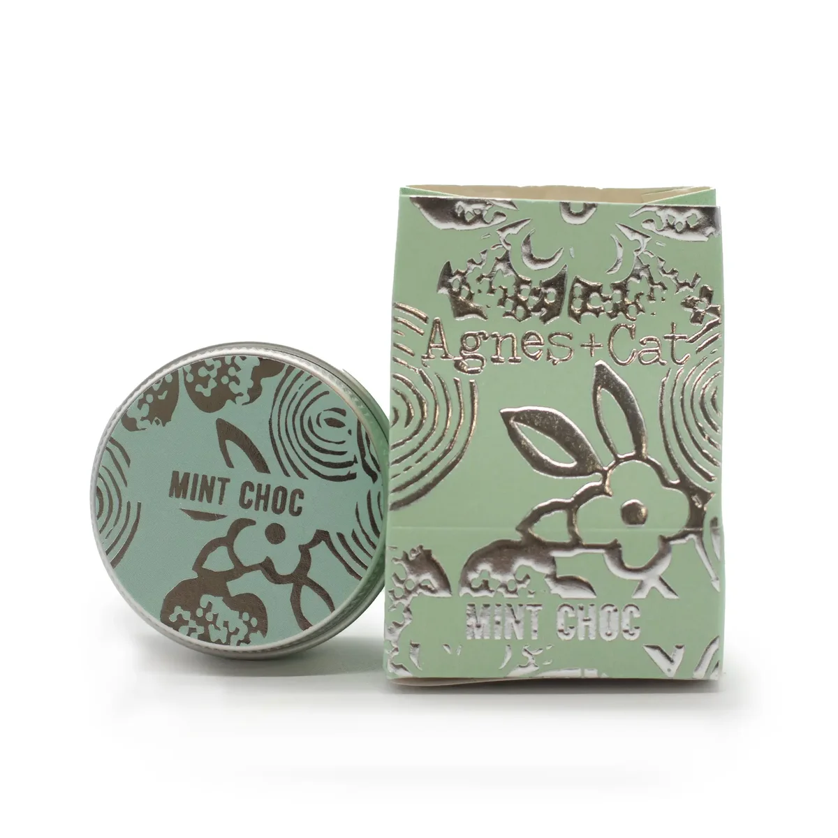Agnes + Cat lip balm tube in mint chocolate flavor with green and brown packaging on white background