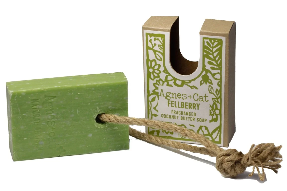 Soap with rope, a firm soap bar tied in a loop, suspended from a knot.