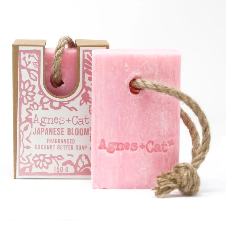 Soap on a rope with Japanese Bloom motif hanging from a string