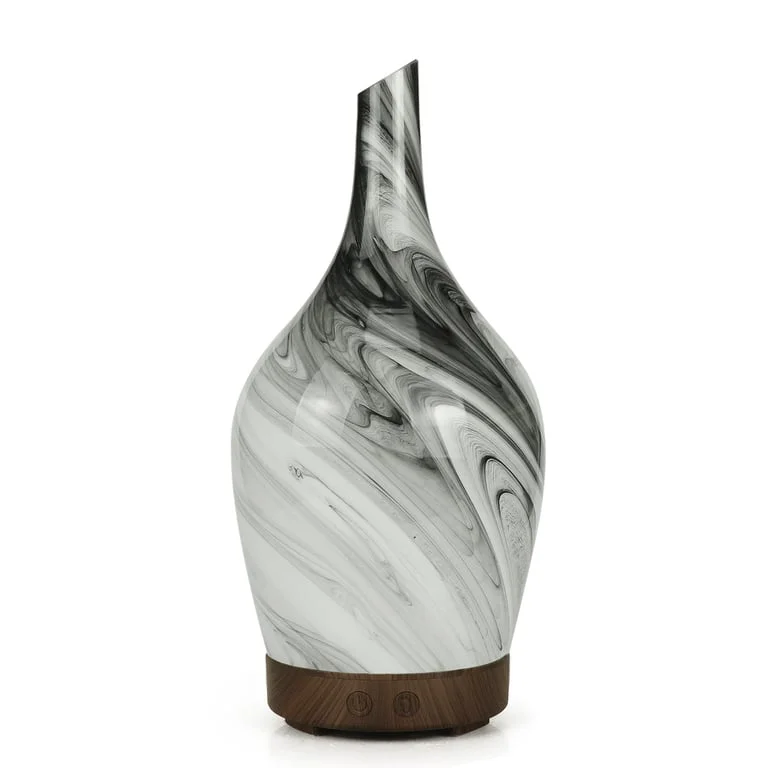 Glass aroma diffuser featuring an abstract grey glass body with integrated USB connector, displayed on a surface.