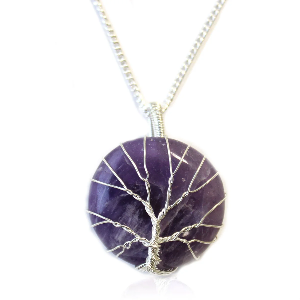 Tree of Life necklace with a purple amethyst gemstone pendant on a silver chain against a white background