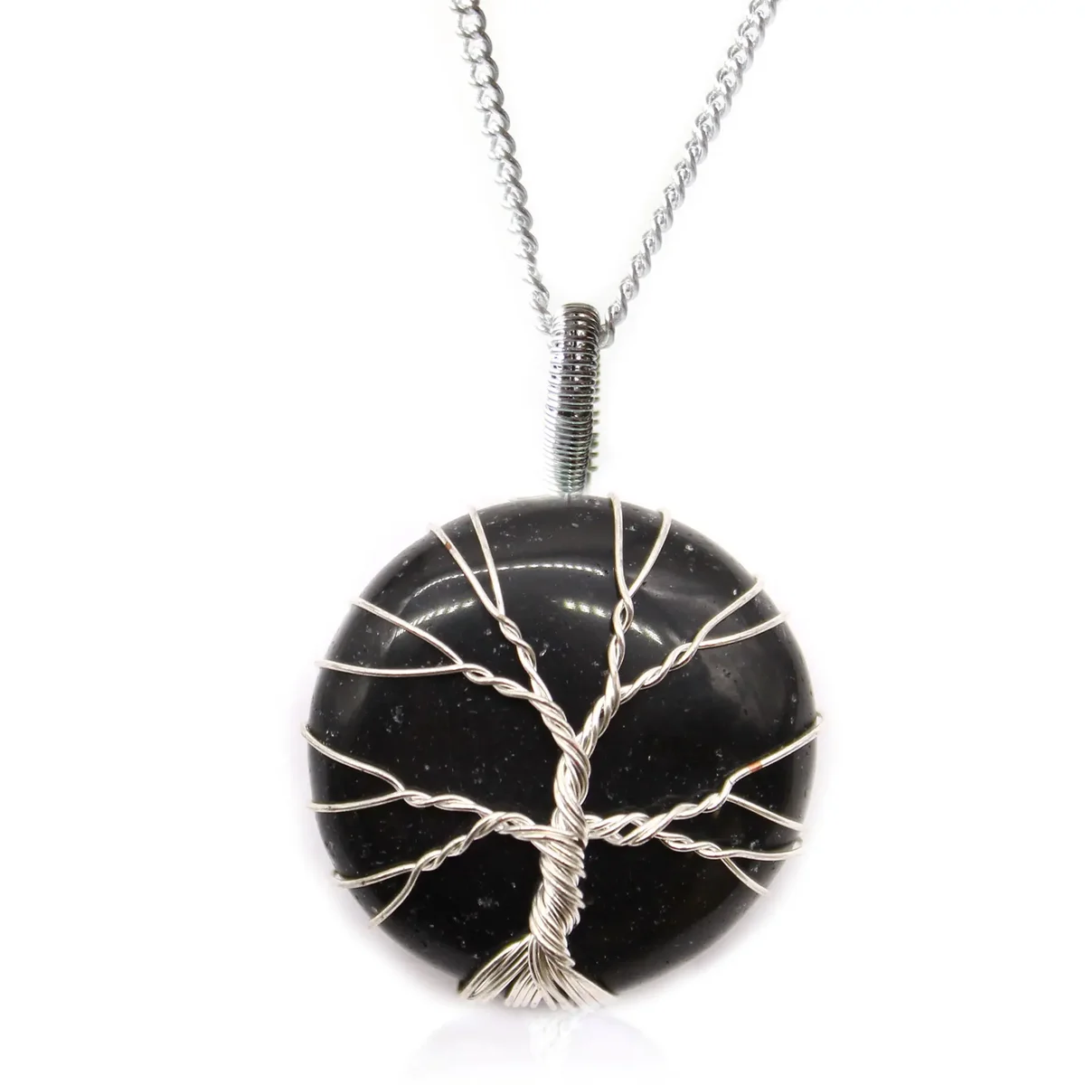 Tree of Life pendant on a black onyx necklace with a silver chain against a white background