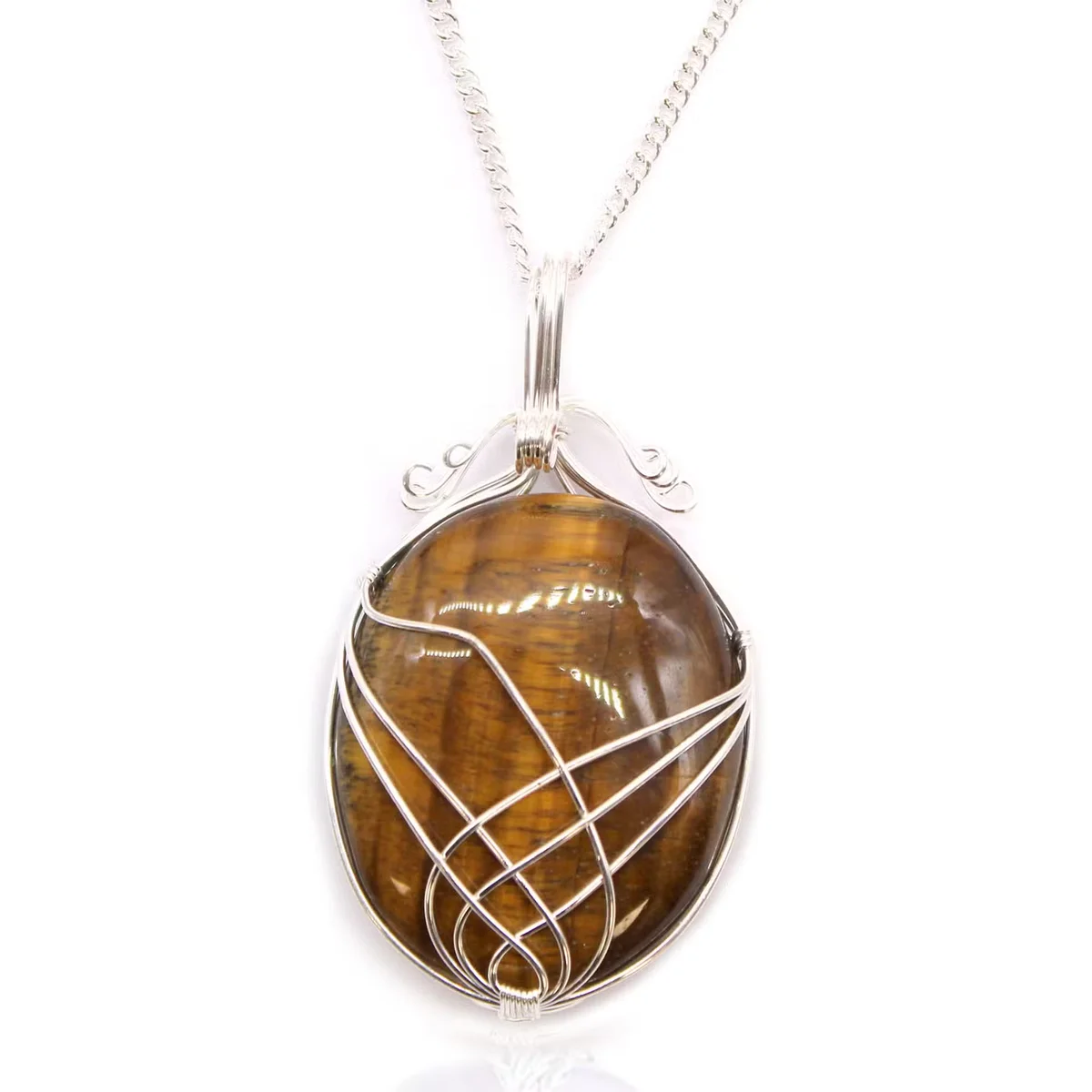 Close-up of swirl wrapped tiger eye pendant on a fashion gemstone necklace with silver chain against white background