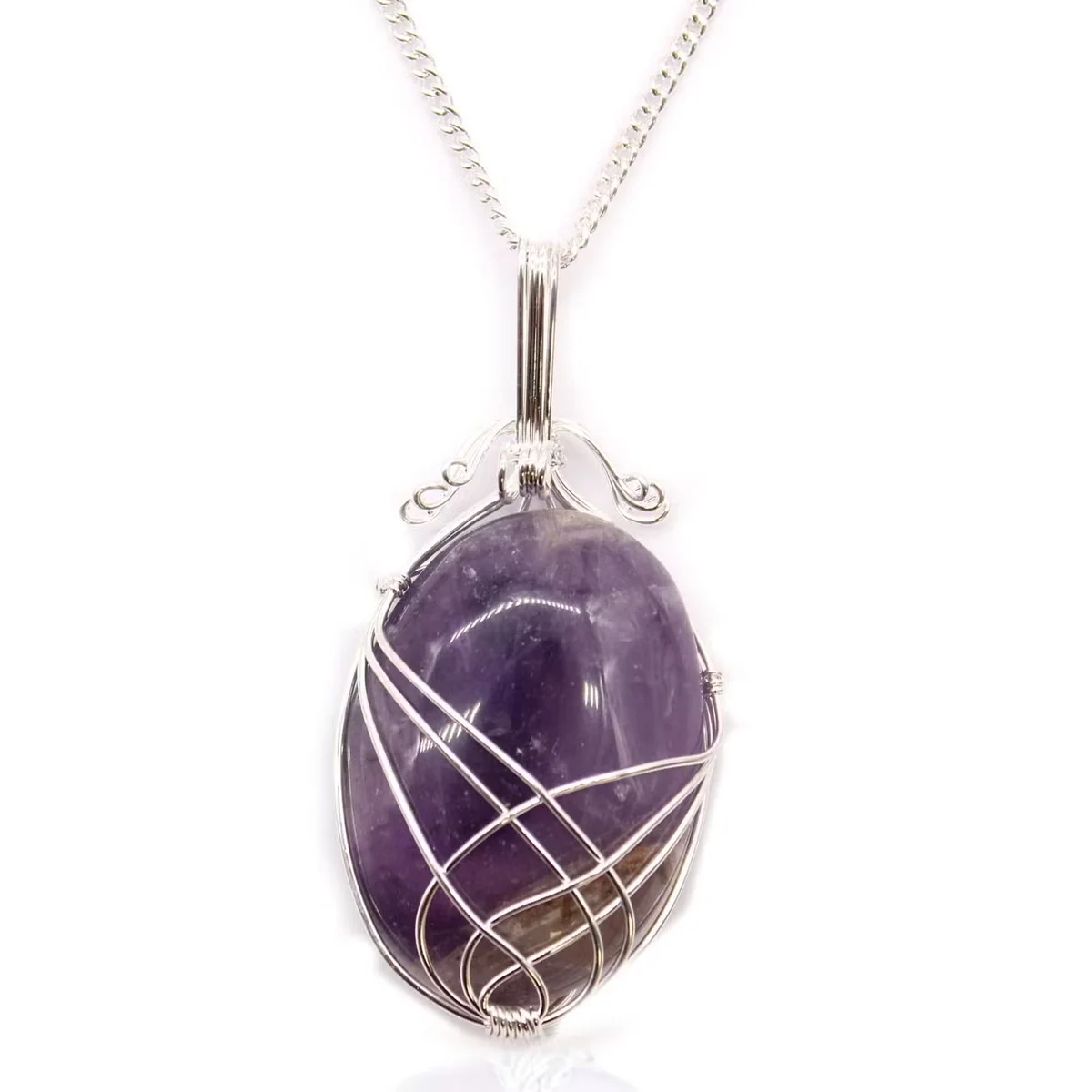 Close-up of swirl wrapped amethyst gemstone pendant on silver chain, showcasing amethyst jewellery UK design details