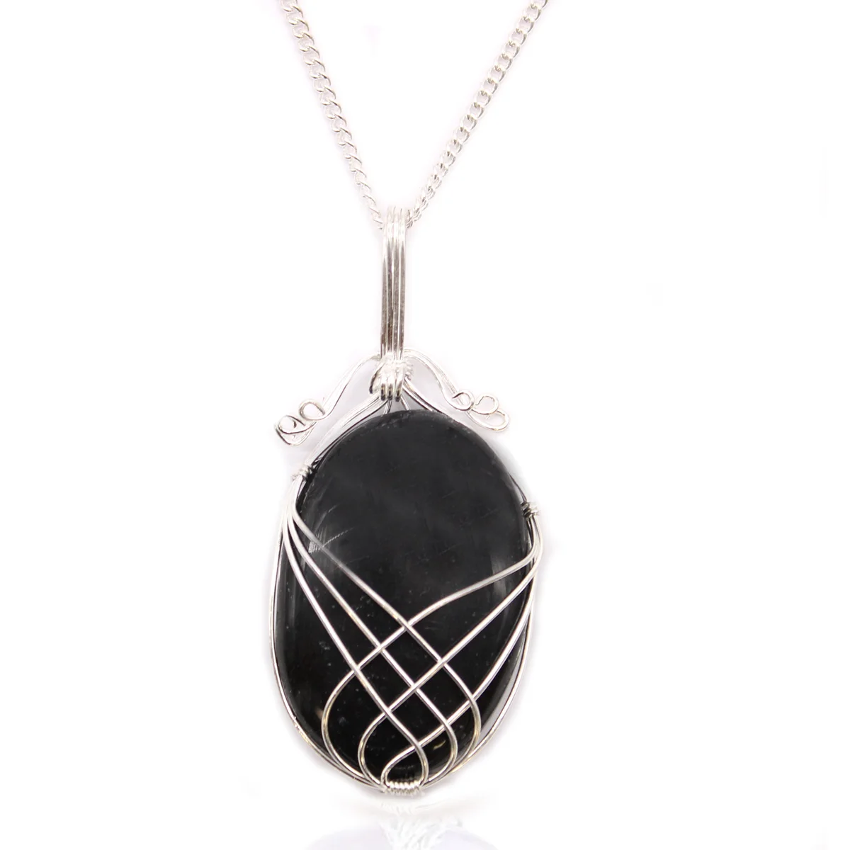 Close-up of black onyx gemstone necklace with swirl wrapped design on a silver chain against white background