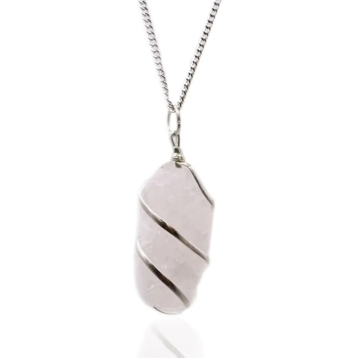 Close-up of rough rose quartz gemstone pendant necklace with silver wrap detailing on a white background