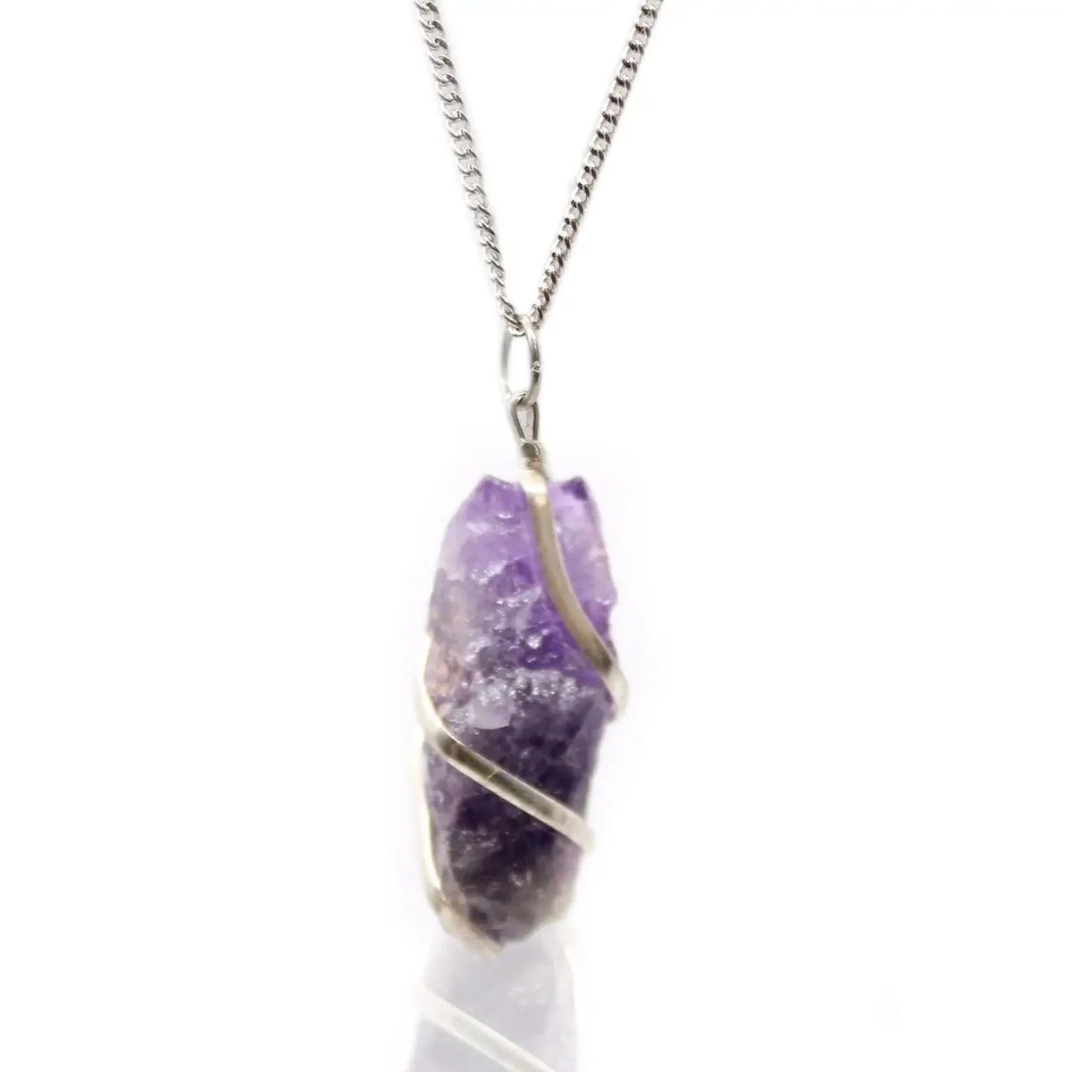 Cascade wrapped rough amethyst gemstone wrapped necklace with silver chain on white background