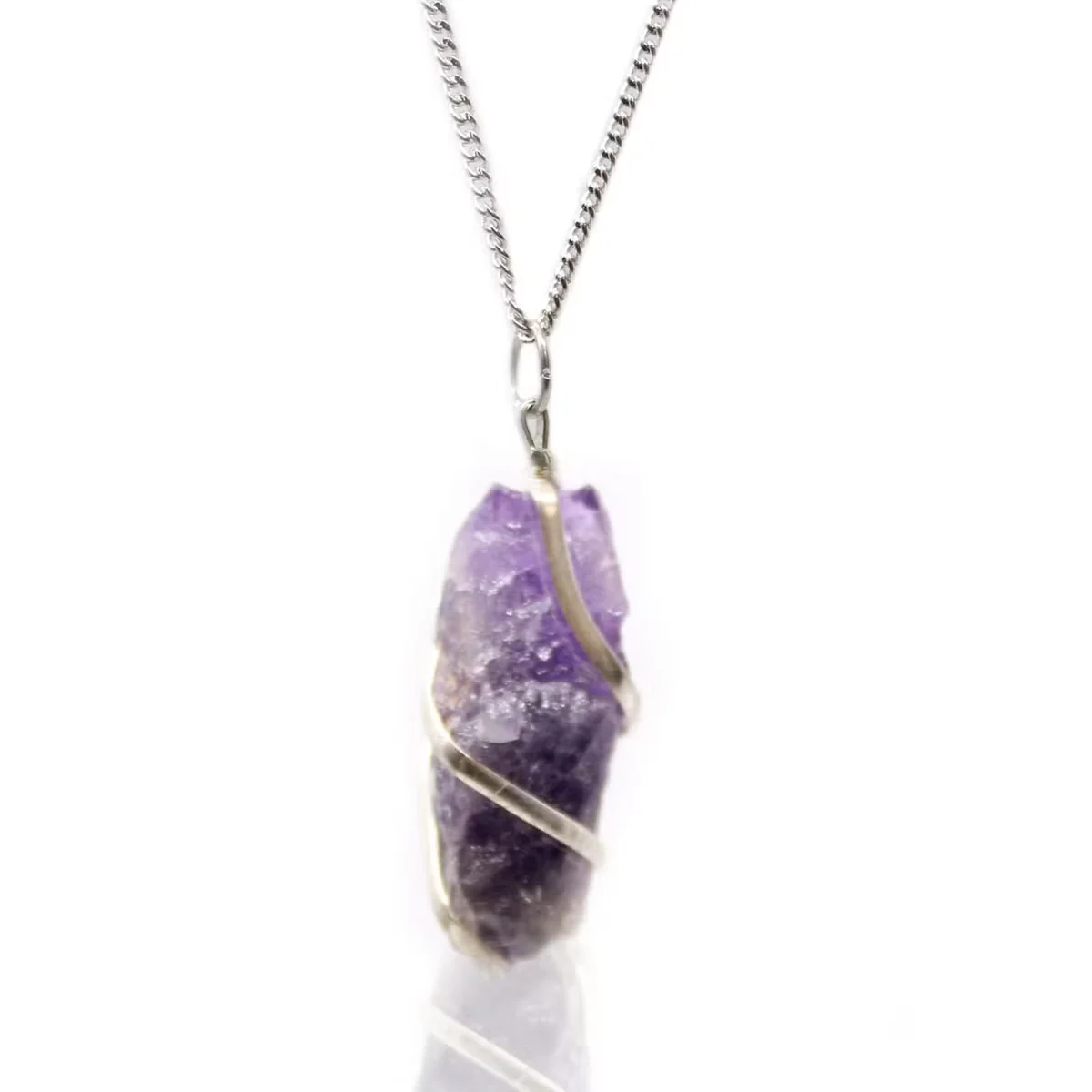 Cascade wrapped rough amethyst natural stone necklace with silver chain displayed on white background