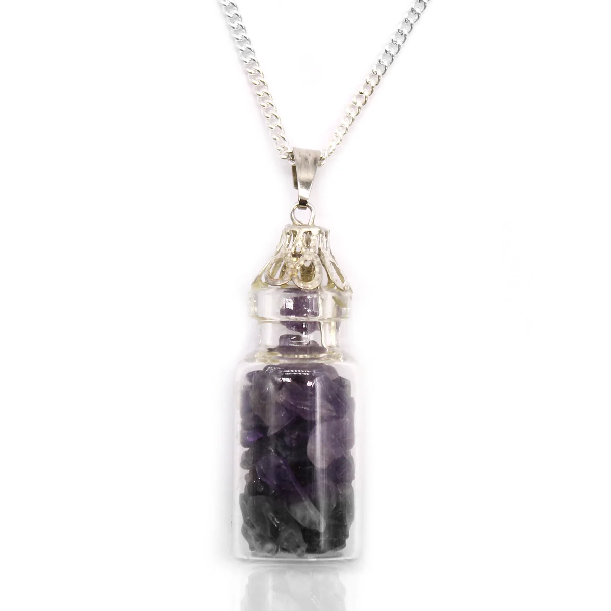 Close-up of a purple gemstone necklace featuring amethyst stones in a small glass bottle pendant on a silver chain