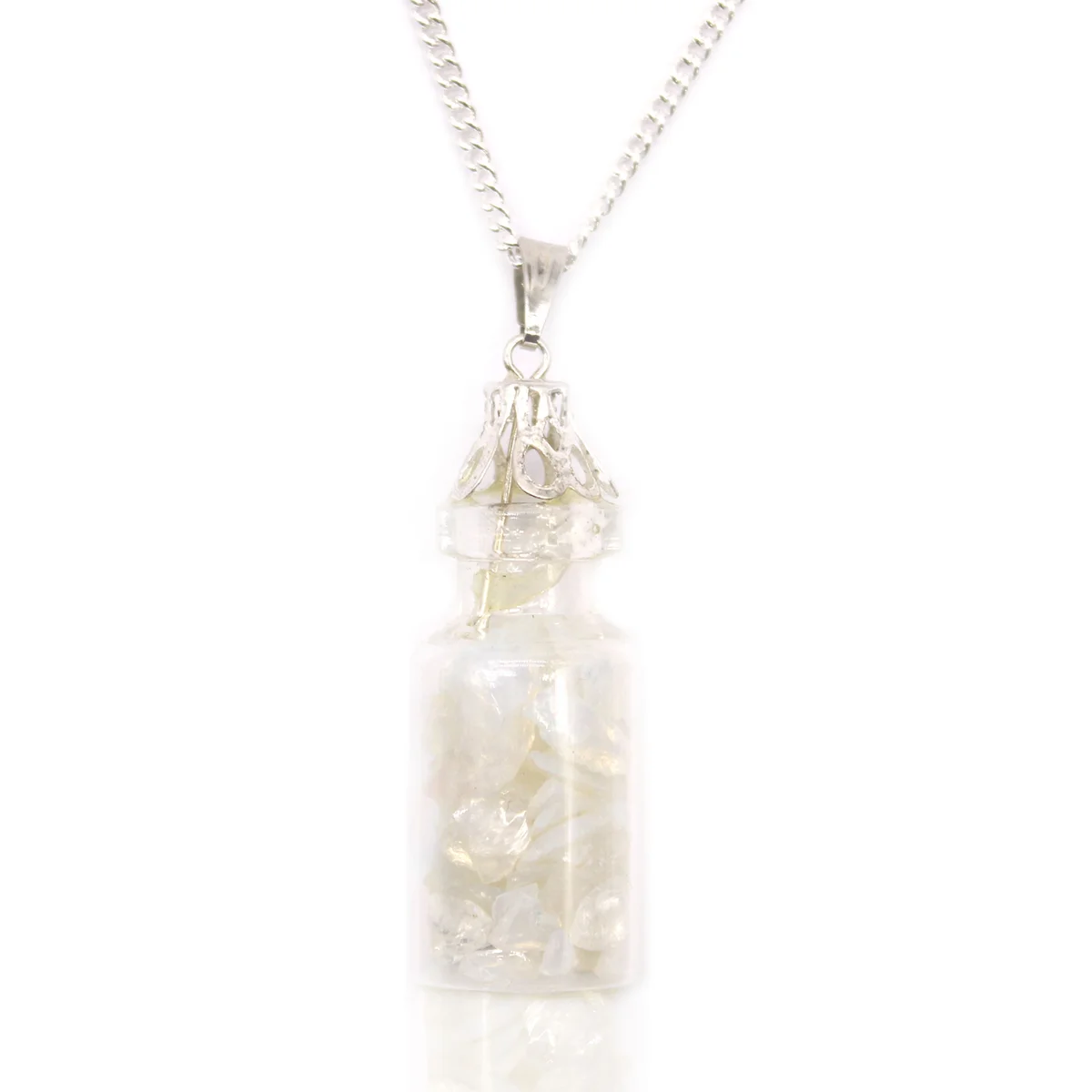Close-up of opalite pendant necklace with small gemstone bottle on silver chain against white background