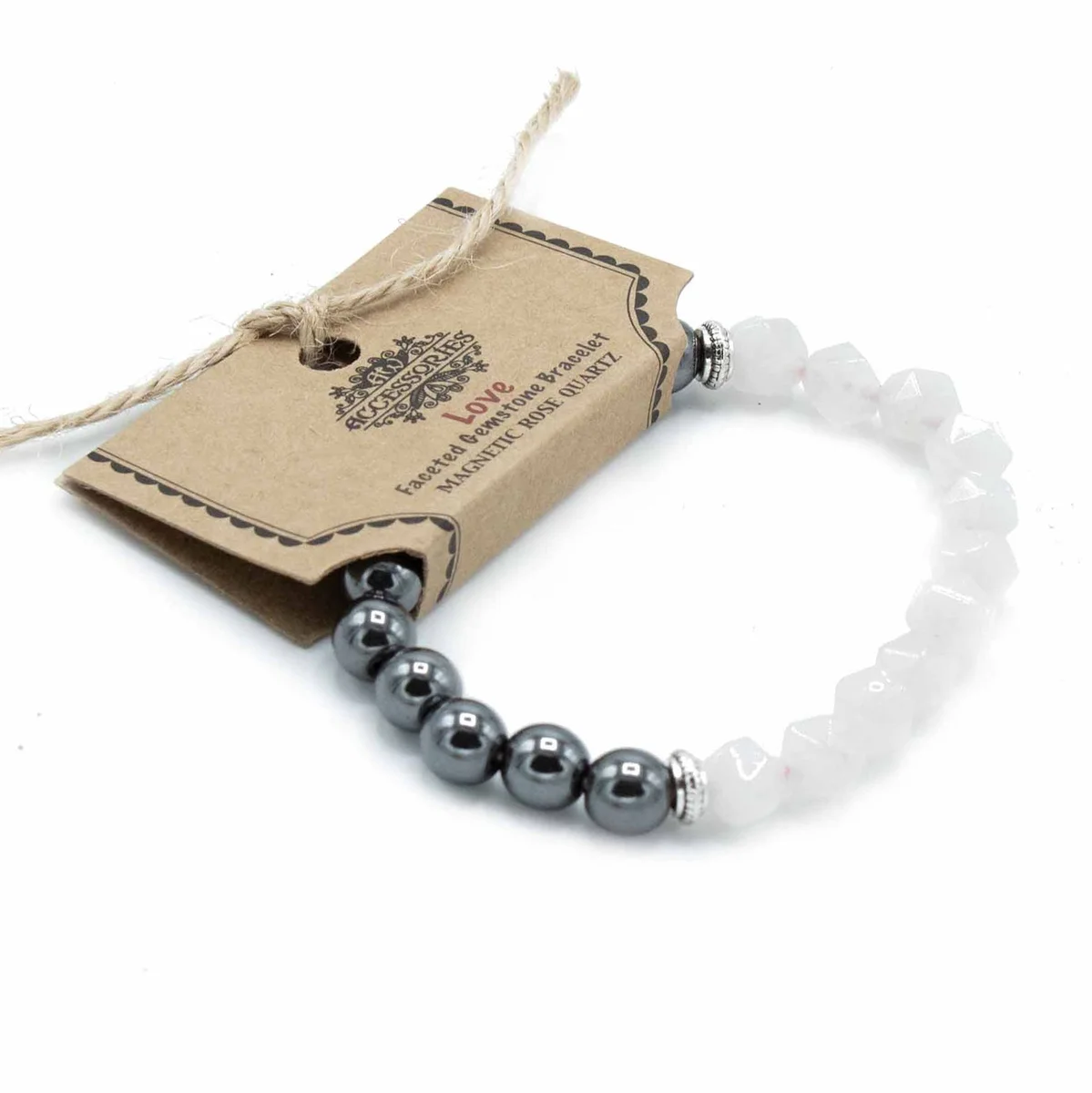 Faceted rose quartz bracelet with magnetic beads arranged in a stylish design on a white background