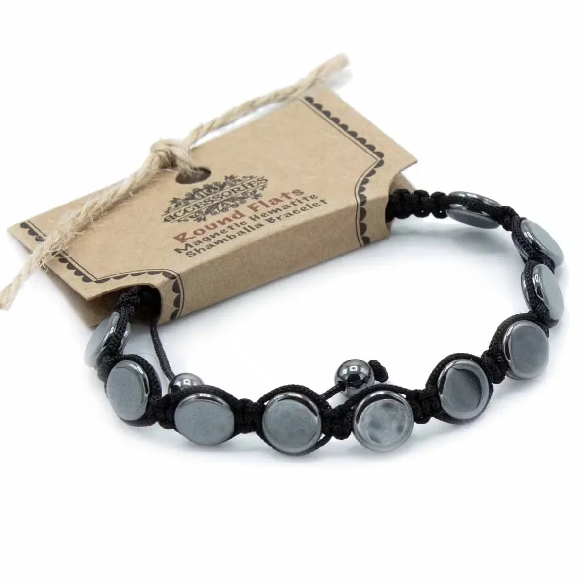 Close-up of magnetic hematite Shamballa bracelet with round flat beads, magnetic jewellery for men on white background