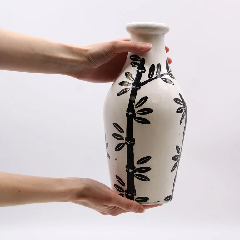 Natural shaped vase featuring a bamboo motif, crafted from natural materials.