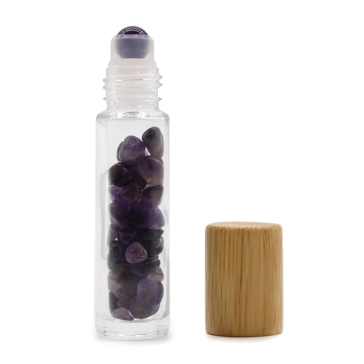 Amethyst essential oil roller bottle with wooden cap, gemstone visible inside.