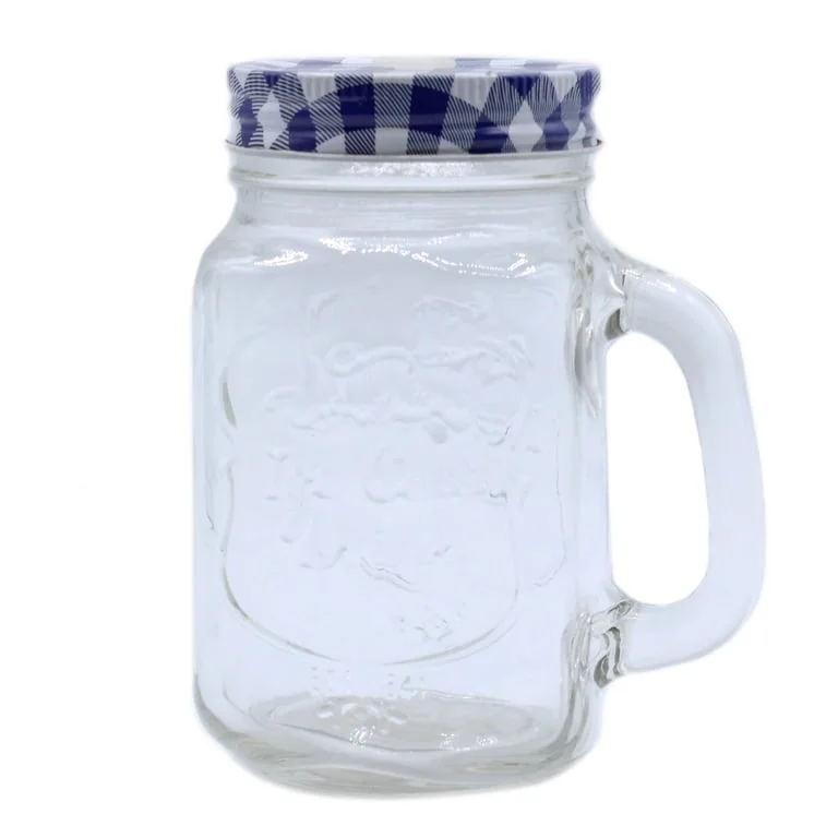 Funky mason jar, clear glass holding ice cubes, showcases an ice cold drink vessel