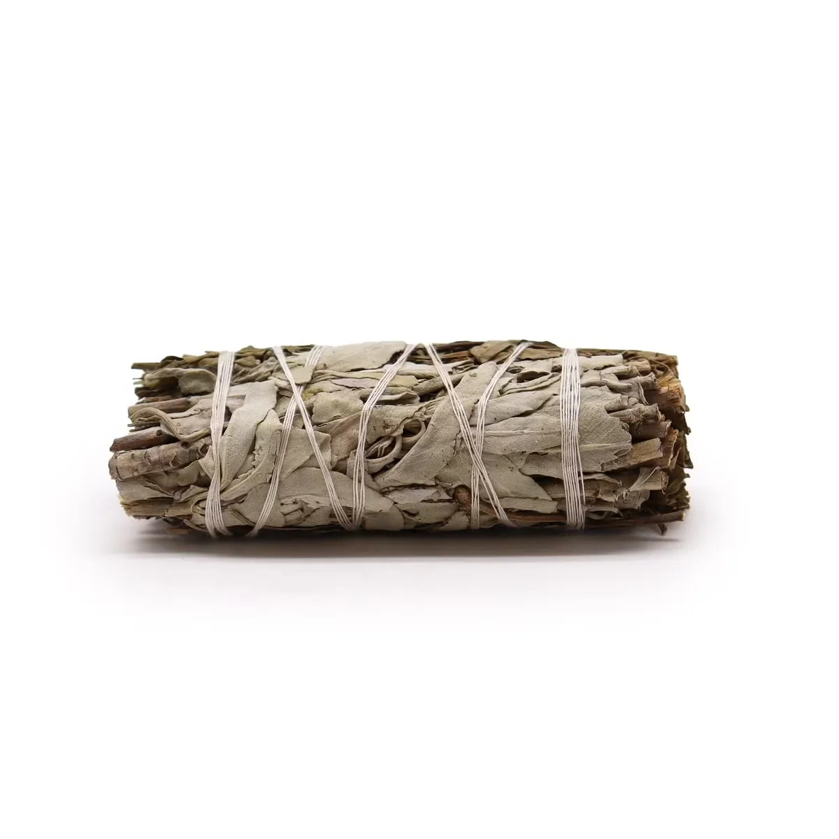 Smudge stick made of white sage and pirul foliage for natural cleansing smudge rituals on a white background