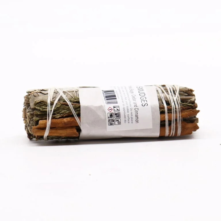 Smudge stick featuring cedar and cinnamon smudge, wrapped in white sage.