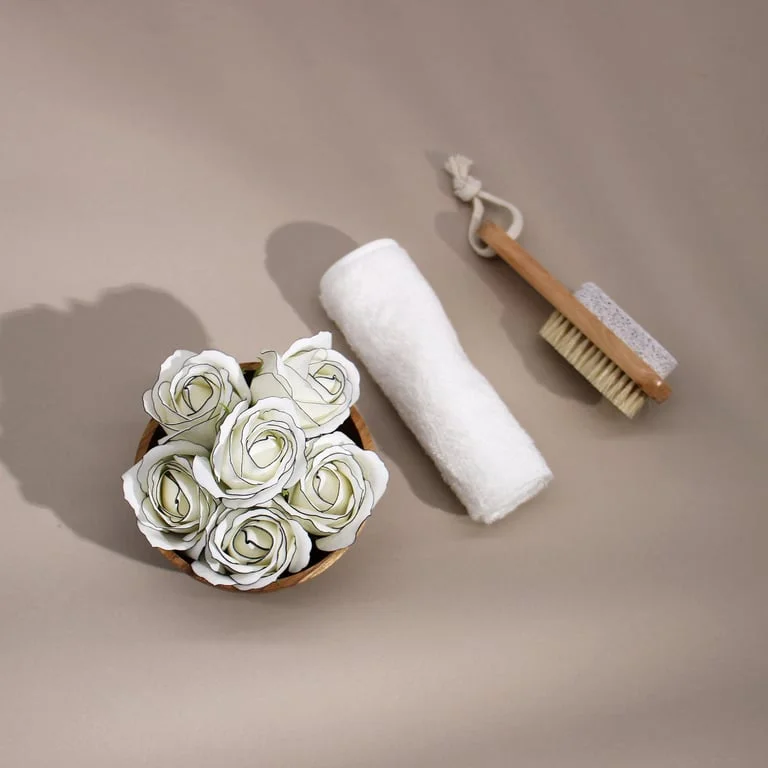 Ivory med rose soap shaped like a rose flower, edged with a black rim