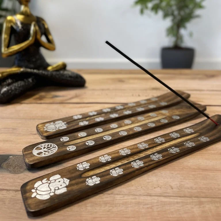 Carved mango wooden ashcatcher with a burnt finish and intricate detailing