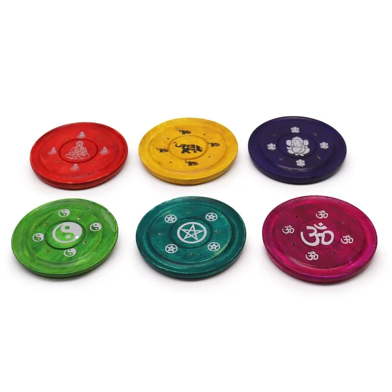 Assorted incense plates displayed in a variety of designs