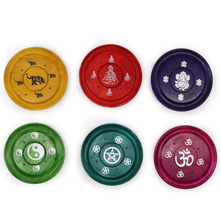 Assorted decorative incense holders displayed on a simple background.