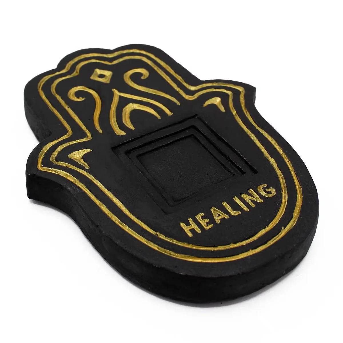 Black and gold lava-stone effect healling incense burner plate with textured surface on white background