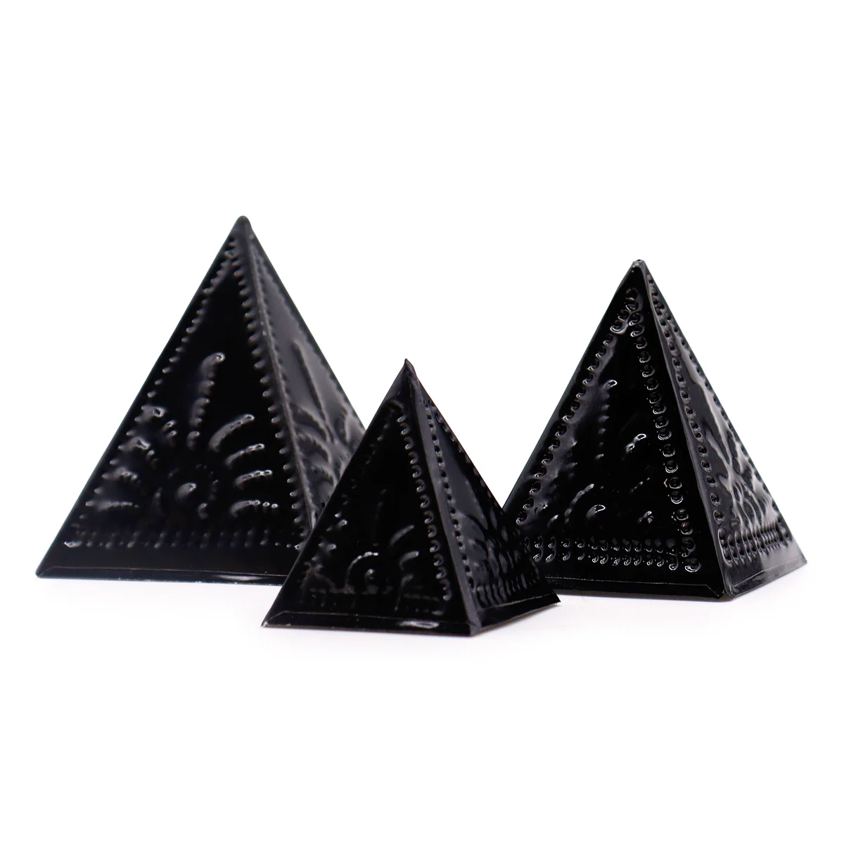 Black incense powder mould set components arranged for use in an incense making kit on a white background