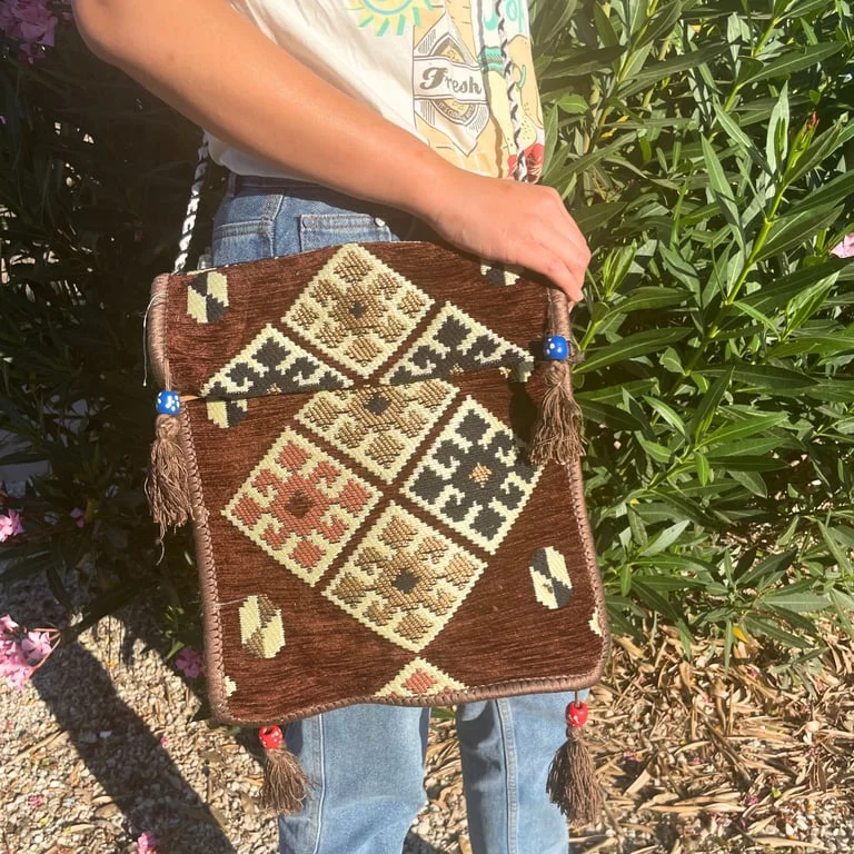 Chocolate kilim festival messenger bag displayed in photo.
