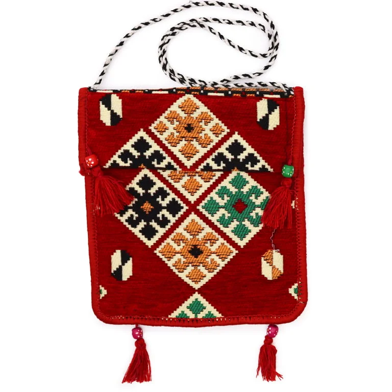 Red kilim messenger bag displayed against a plain background.