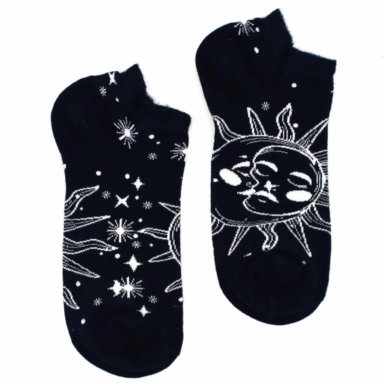 M/L bamboo socks with hop hare sun and moon design, soft earthy tones, folded over a wooden background