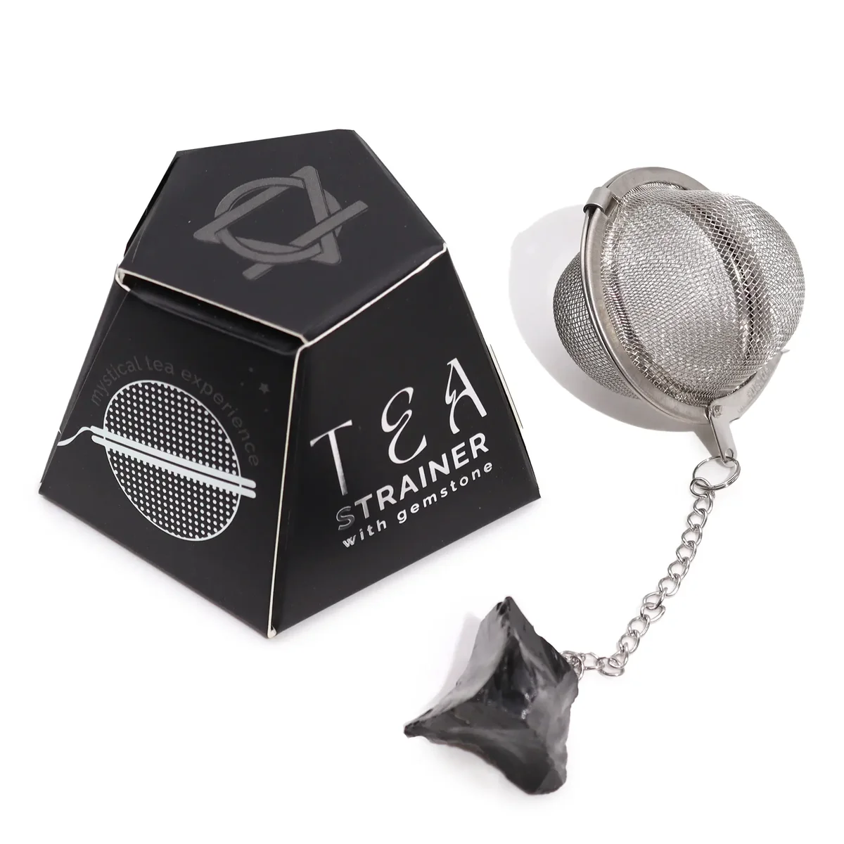 Black obsidian tea strainer made from raw crystal gemstone with a metal mesh infuser and handle on white background
